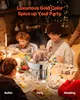 A family is gathered around a table for a meal, with a roasted turkey in a chafing dish as the centerpiece. Produktbild-Vorschau