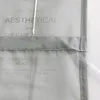 A close-up view of a translucent fabric with printed text, possibly a curtain or blind, showing event details. Produktbild-Vorschau