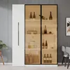 A modern white and glass display cabinet filled with bottles and dishes, set against a gray wall. Produktbild-Vorschau