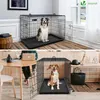 Collage showing two different dog crates with dogs inside, one in a home setting and one in a living room. Produktbild-Vorschau