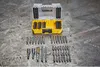 A set of Dewalt screwdriver bits and accessories laid out on a textured surface. Anteprima dell’immagine prodotto