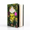 A book cover with a forest scene and characters, standing open on a white surface. Anteprima dell’immagine prodotto