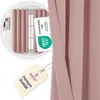 A close-up of a pink curtain with certification tags attached. Produktbild-Vorschau