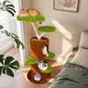 A cat tree with multiple levels and platforms, decorated with green, moss-like surfaces, is placed in a room with a bed and a window. Produktbild-Vorschau