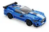 A blue Lego-style sports car with white racing stripes and a rear spoiler, shown from a three-quarter front angle on a white background. Produktbild-Vorschau