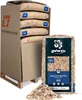 A pallet of bagged wood chips with a single bag in the foreground. Produktbild-Vorschau