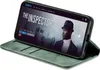 A smartphone in a green flip case is displayed on a white background, showing a movie poster on its screen. Produktbild-Vorschau