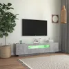 A modern living room with a TV stand, TV, plant, and decor. Anteprima dell’immagine prodotto