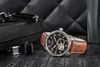 A watch and cufflinks are displayed on a textured surface with a quilted background. Náhled obrázku produktu