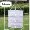 A three-layer drying net hanging outdoors, with dimensions indicated by text overlays. Produktbild-Vorschau