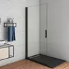 A modern bathroom with a black framed glass shower enclosure and a wooden floor. Produktbild-Vorschau