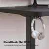 A close-up shot of a desk with headphones hanging from a hook. Náhled obrázku produktu
