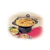 A TEFAL electric wok filled with noodles and vegetables, placed on its stand, with side dishes of salad and noodles. Produktbild-Vorschau