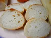 Close-up view of sliced bread on a wooden surface. Náhled obrázku produktu