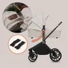 A collage showing a baby stroller and its components, with a person interacting with one of the parts. Voir les images du produit