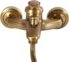 A close-up studio shot of a vintage-style shower faucet with a handheld showerhead. Náhled obrázku produktu