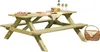 A wooden picnic table set up with food and drinks. Produktbild-Vorschau