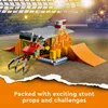 A LEGO stunt park playset with a spider vehicle, ramps, and fire elements, set in a stadium-like environment. Podgląd zdjęcia produktu