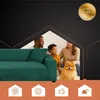 A family and their dog are sitting on a green sofa, framed by a house-like graphic. Podgląd zdjęcia produktu