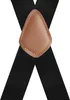 A close-up studio shot of black suspenders with a brown leather connector. Anteprima dell’immagine prodotto