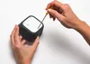 Hands are shown using a screwdriver to assemble or disassemble a small electronic device. Produktbild-Vorschau