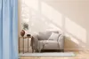 A cozy living room scene with a chair, side table, and curtain. Produktbild-Vorschau