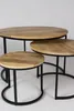 A set of three round nesting tables with wooden tops and black metal frames against a white background. Voir les images du produit