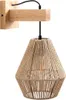 A wall lamp with a wooden base and a rope shade. Voir les images du produit