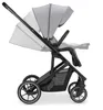 A side view of a gray and black stroller against a white background. Produktbild-Vorschau