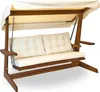 A wooden swing set with beige cushions and a beige canopy, shown against a white background. Produktbild-Vorschau