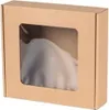 A brown cardboard box with a clear window, showing a white object inside. Náhľad obrázku produktu