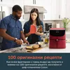 A couple is in a kitchen, preparing food with a red air fryer visible. Produktbild-Vorschau