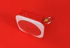 A red and white portable Bluetooth speaker with a rainbow-colored loop is shown against a solid red background. Produktbild-Vorschau