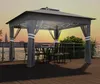 A gazebo with a table and chairs set up on a wooden deck overlooking a body of water at sunset. Produktbild-Vorschau