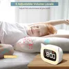 A child is sleeping peacefully in bed, with musical notes and sound waves emanating from a digital alarm clock. Produktbild-Vorschau