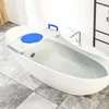 A white bathtub with a bath seat installed across it, filled with water. Náhľad obrázku produktu
