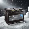 A car battery sits in the snow with snowflakes falling. Podgląd zdjęcia produktu