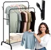 A woman is holding up a light blue shirt in front of a clothing rack filled with various colored shirts. There are also storage boxes on the bottom shelf of the rack. Podgląd zdjęcia produktu