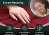 A hand touching a red blanket, with a woman sleeping peacefully in the background and feature icons at the bottom. Produktbild-Vorschau