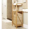 A bathroom scene with a bamboo laundry basket and shelf unit. Podgląd zdjęcia produktu