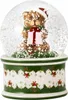 A Christmas-themed snow globe featuring a teddy bear holding a gift. Produktbild-Vorschau
