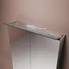 Close-up view of the top of a mirrored cabinet with a light fixture and power supply. Náhled obrázku produktu