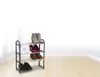 A shoe rack with shoes on it, set against a white wall and wooden floor. Produktbild-Vorschau