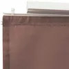 A close-up view of the top edge of a brown fabric curtain hanging from a white track. Voir les images du produit