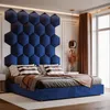 A bedroom scene with a large blue hexagonal headboard and a bed. Náhled obrázku produktu