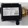 A close-up shot of an electrical heating element with a control box and label. Produktbild-Vorschau