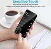 A hand holding a smartphone displaying an alarm clock app, with a cup of coffee and a notebook in the background. Produktbild-Vorschau
