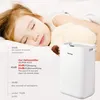 A child sleeping peacefully next to a dehumidifier. Anteprima dell’immagine prodotto