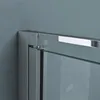 A close-up view of a modern shower enclosure corner, showing the metallic frame and glass panel. Produktbild-Vorschau