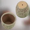 Two ceramic pots are shown against a blurred background. One pot is shown from the top, revealing its interior. The other pot is shown from the side and bottom, with a drainage hole visible. Voir les images du produit